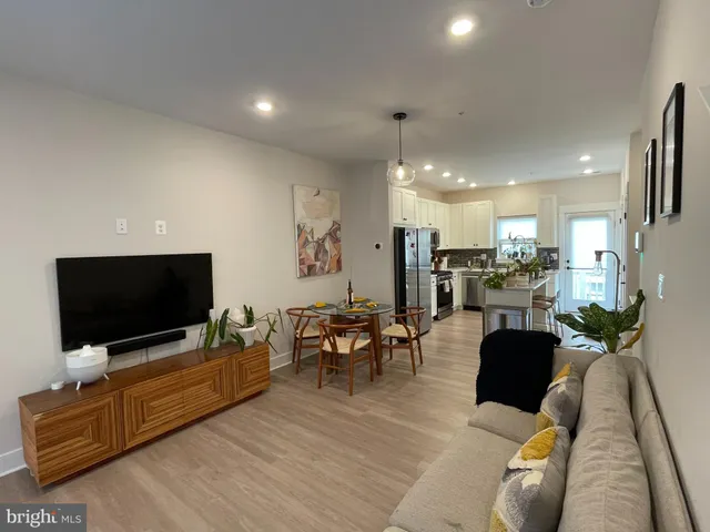a view of a hallway with washer and dryer