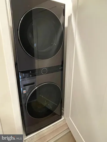 a bathroom with a sink a toilet a mirror and shower