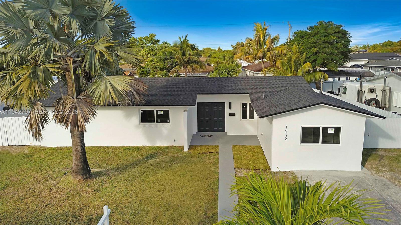 16232 Southwest 107th Court Miami, FL 33157 - Photo 1 of 32 a front view of a house with a yard