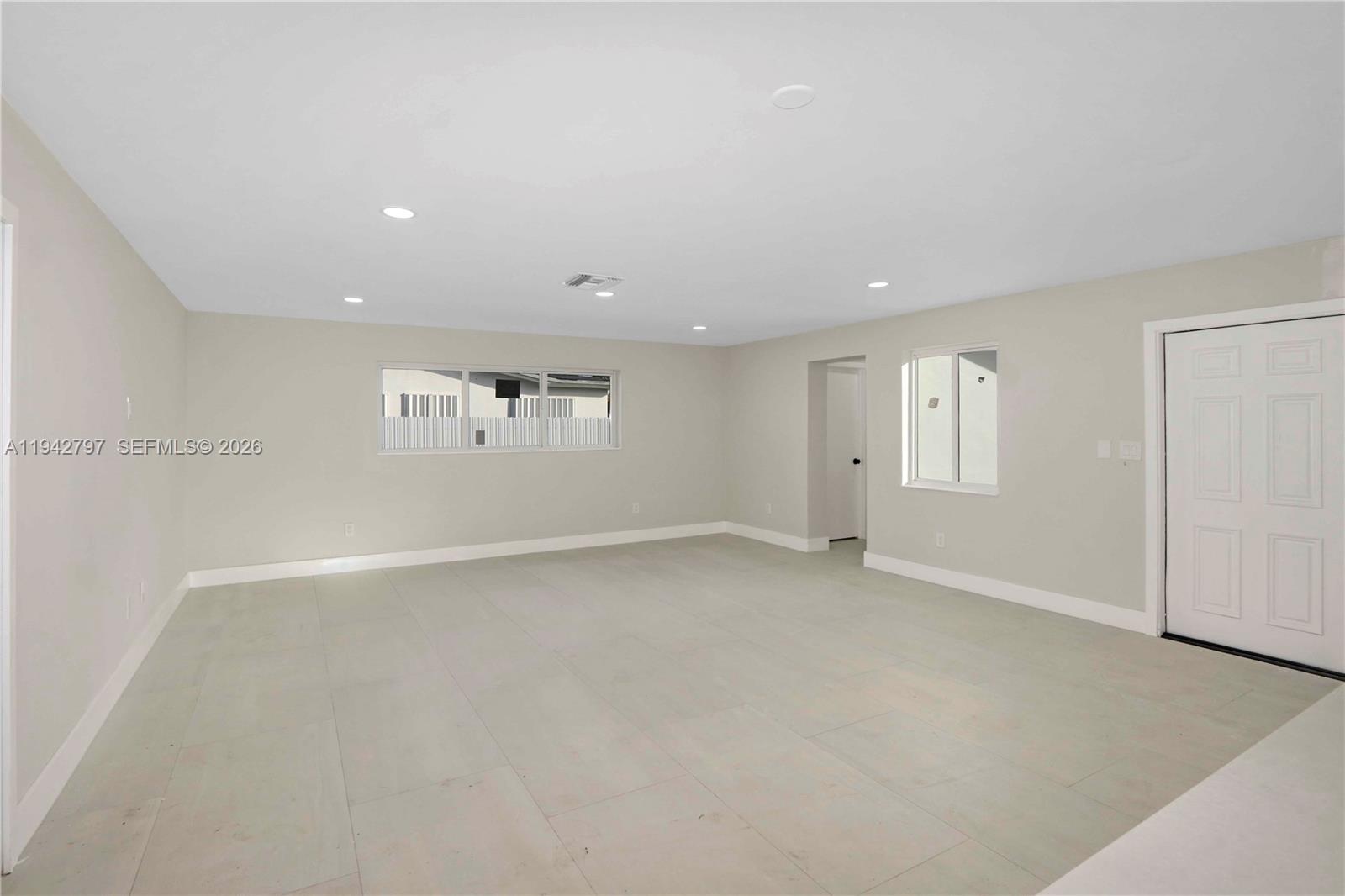 16232 Southwest 107th Court Miami, FL 33157 - Photo 11 of 32 a view of an empty room with a window