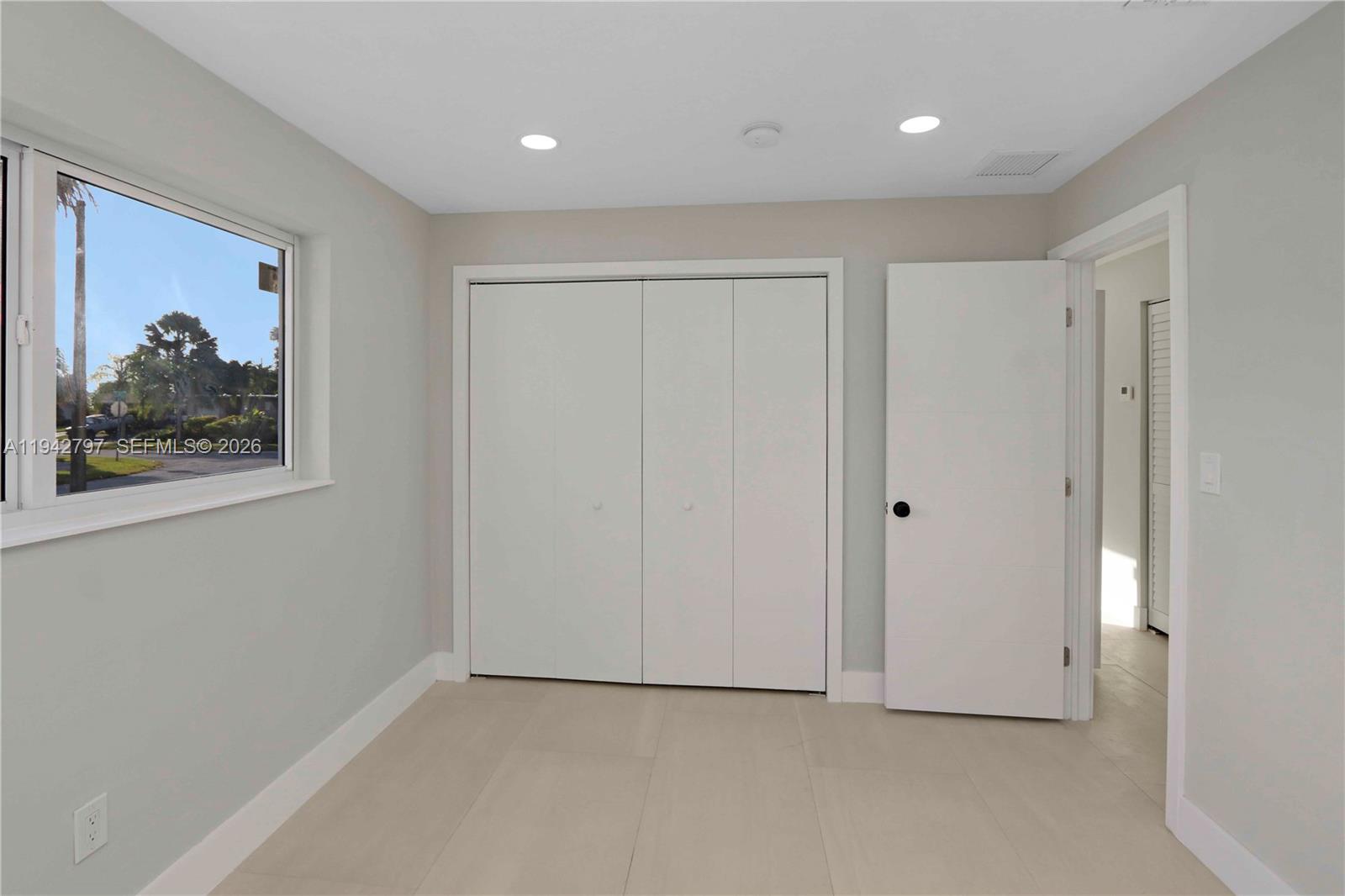 16232 Southwest 107th Court Miami, FL 33157 - Photo 17 of 32 a view of a hallway with closet