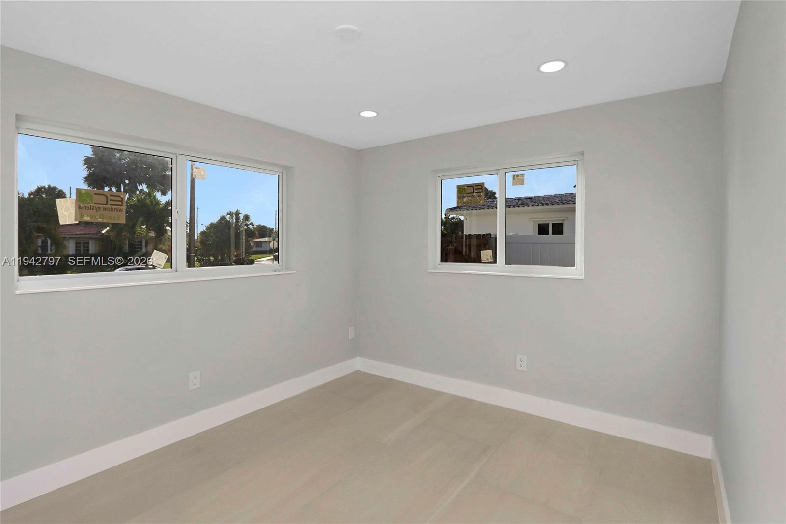 16232 Southwest 107th Court Miami, FL 33157 - Photo 18 of 32 a view of a big room with wooden floor and windows