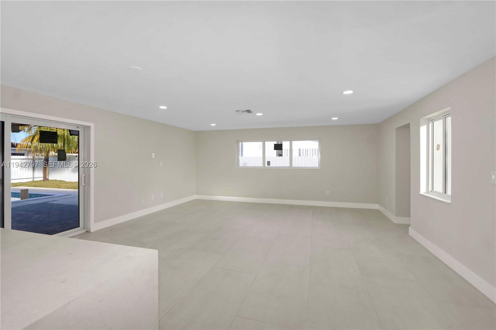 16232 Southwest 107th Court Miami, FL 33157 - Photo 24 of 32 an empty room with windows and closet