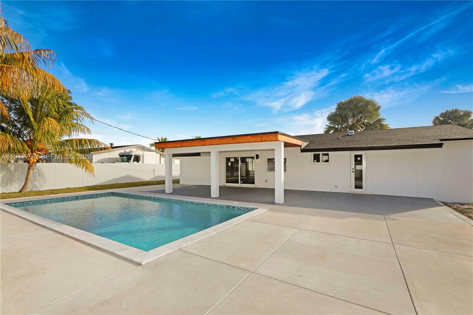16232 Southwest 107th Court Miami, FL 33157 - Photo 25 of 32 a view of a house with a swimming pool