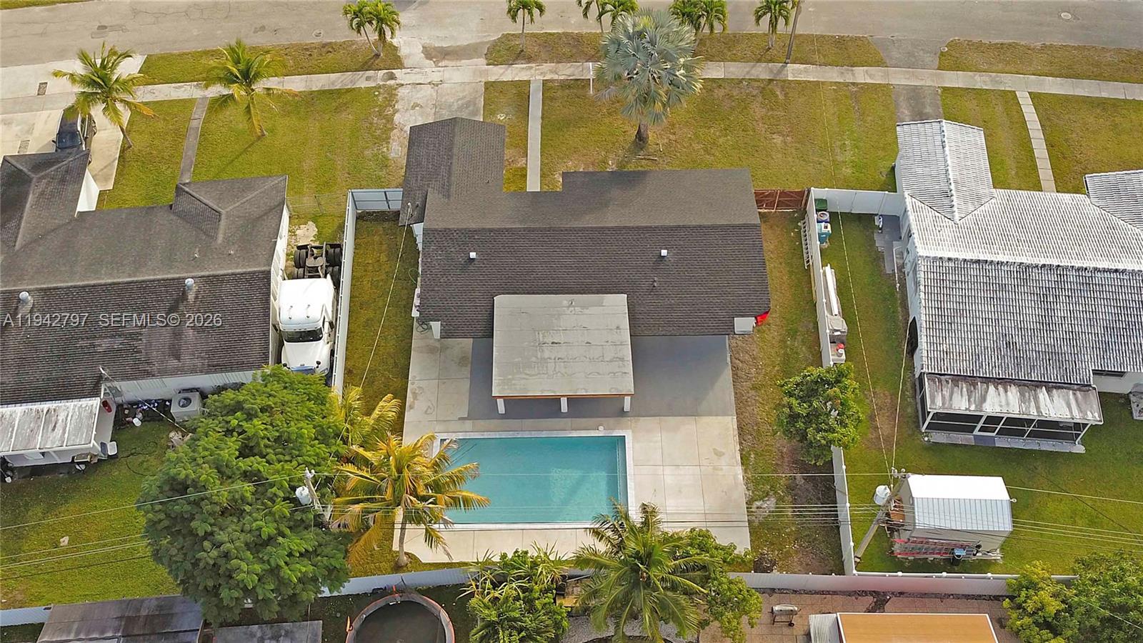 16232 Southwest 107th Court Miami, FL 33157 - Photo 4 of 32 an aerial view of residential houses with outdoor space