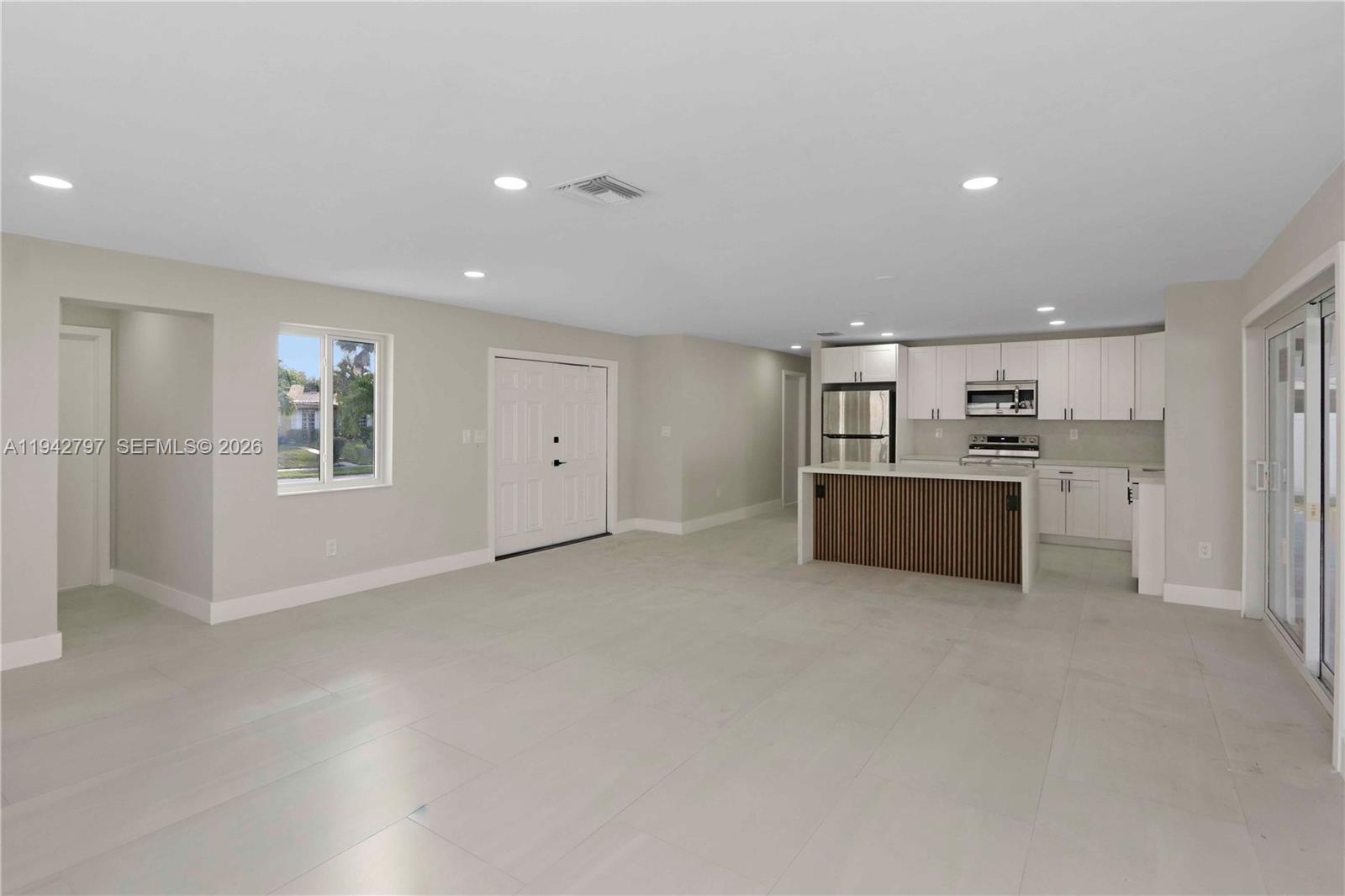 16232 Southwest 107th Court Miami, FL 33157 - Photo 5 of 32 a view of a kitchen with a sink cabinets and a kitchen