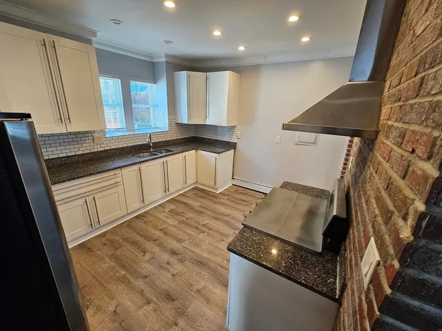a bathroom with a sink and a large mirror