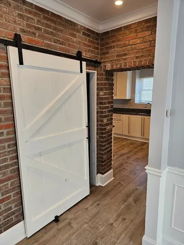 a kitchen with granite countertop a refrigerator and a sink