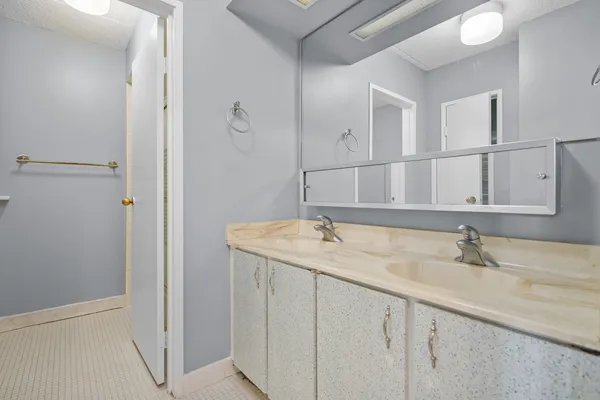 a bathroom with a sink and a mirror