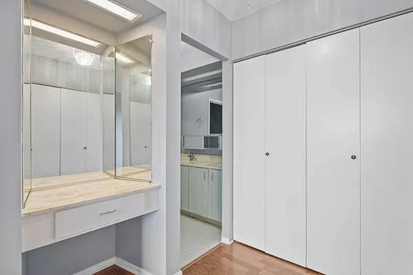 a bathroom with a shower and a sink