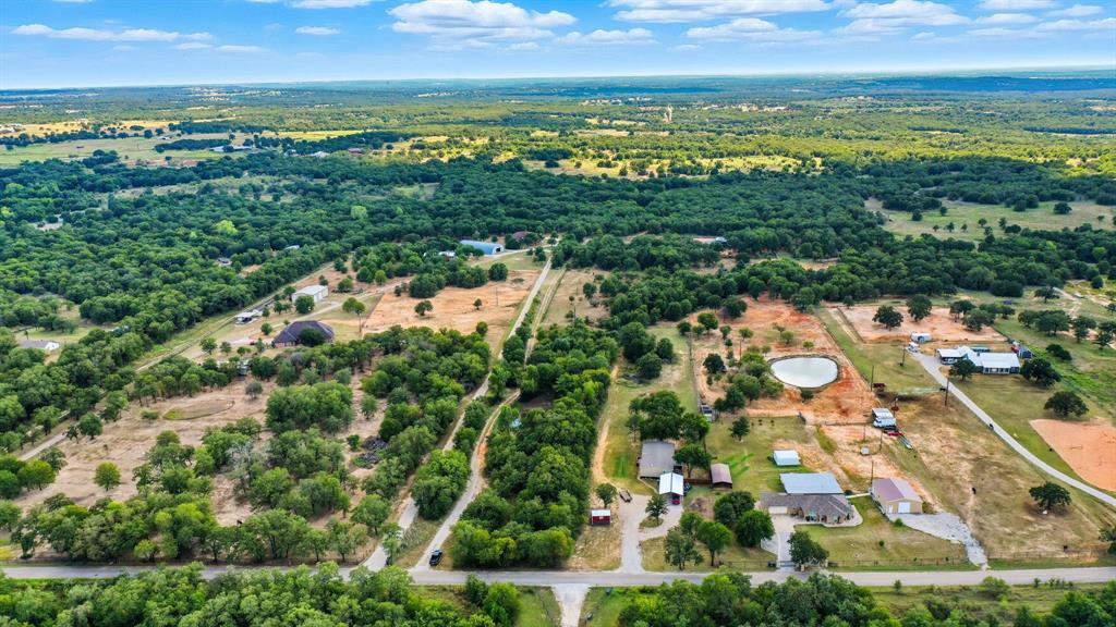 785 Jordan Road Poolville, TX 76487 - Photo 2 of 17 Aerial overview of property's location featuring rural landscape