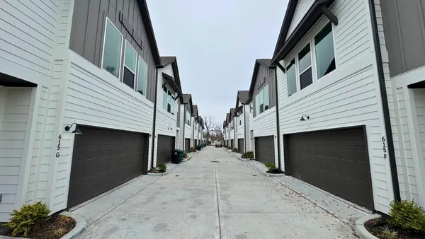 a view of a house with a door and garage