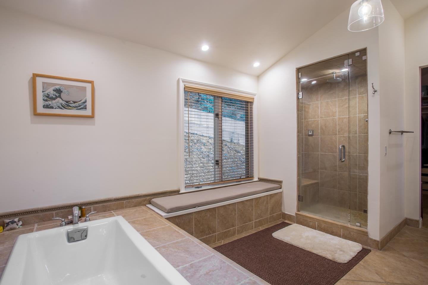 234 Swett Road Woodside, CA 94062 - Photo 11 of 20 a bathroom with a tub a sink and glass door