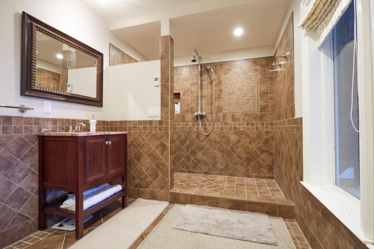 234 Swett Road Woodside, CA 94062 - Photo 12 of 20 a bathroom with a bathtub and a shower