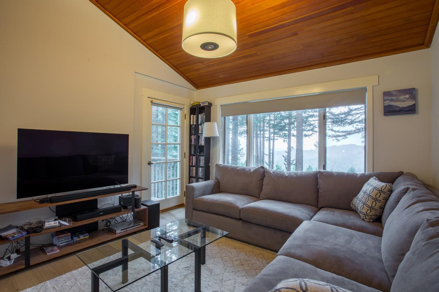 234 Swett Road Woodside, CA 94062 - Photo 13 of 20 a living room with furniture and a flat screen tv