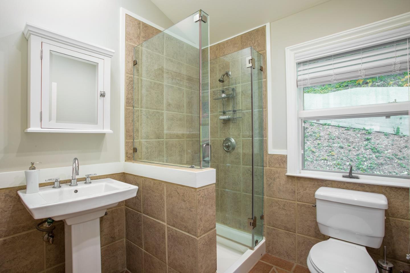 234 Swett Road Woodside, CA 94062 - Photo 14 of 20 a bathroom with a sink toilet and shower