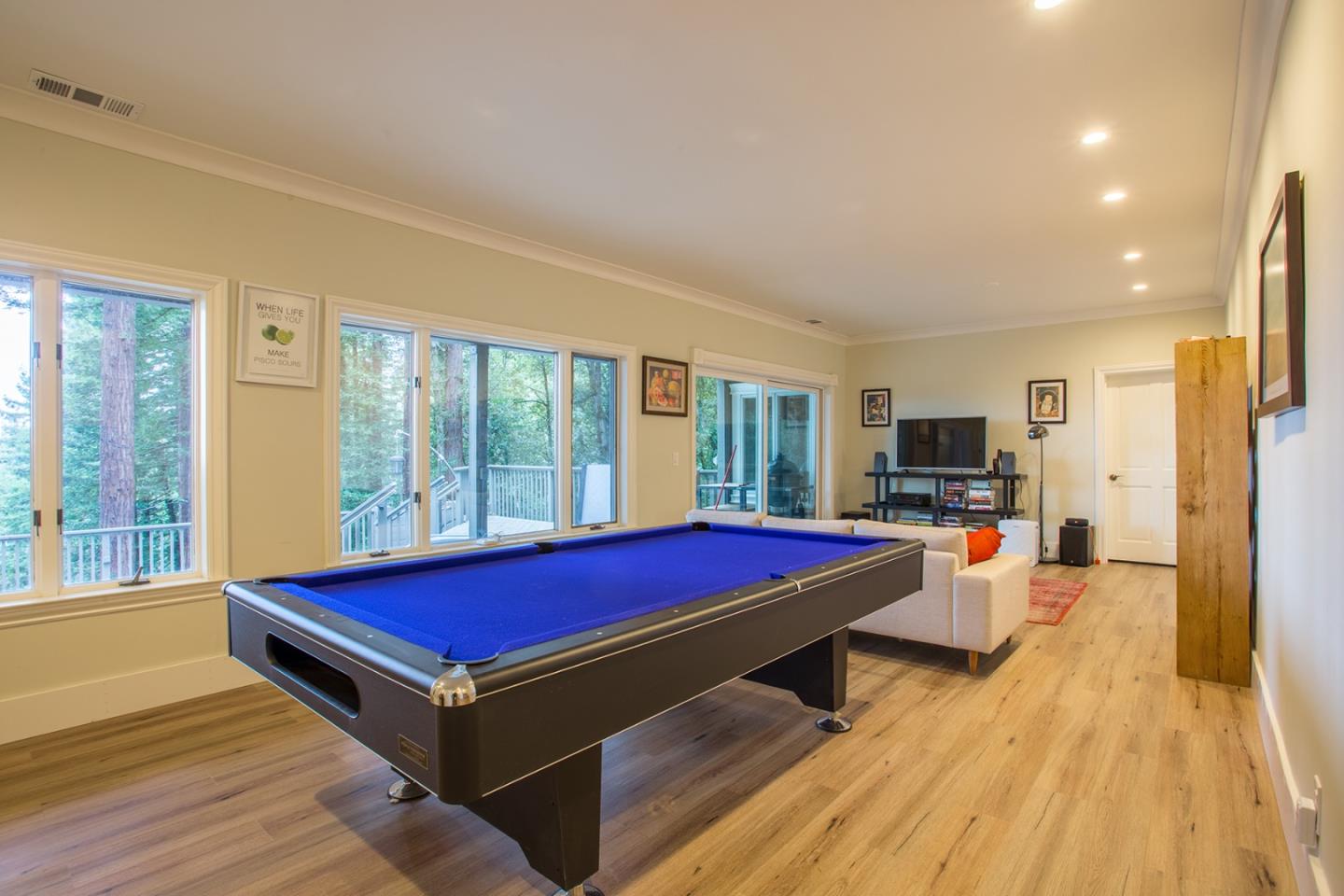 234 Swett Road Woodside, CA 94062 - Photo 15 of 20 a pool with furniture and wooden floor