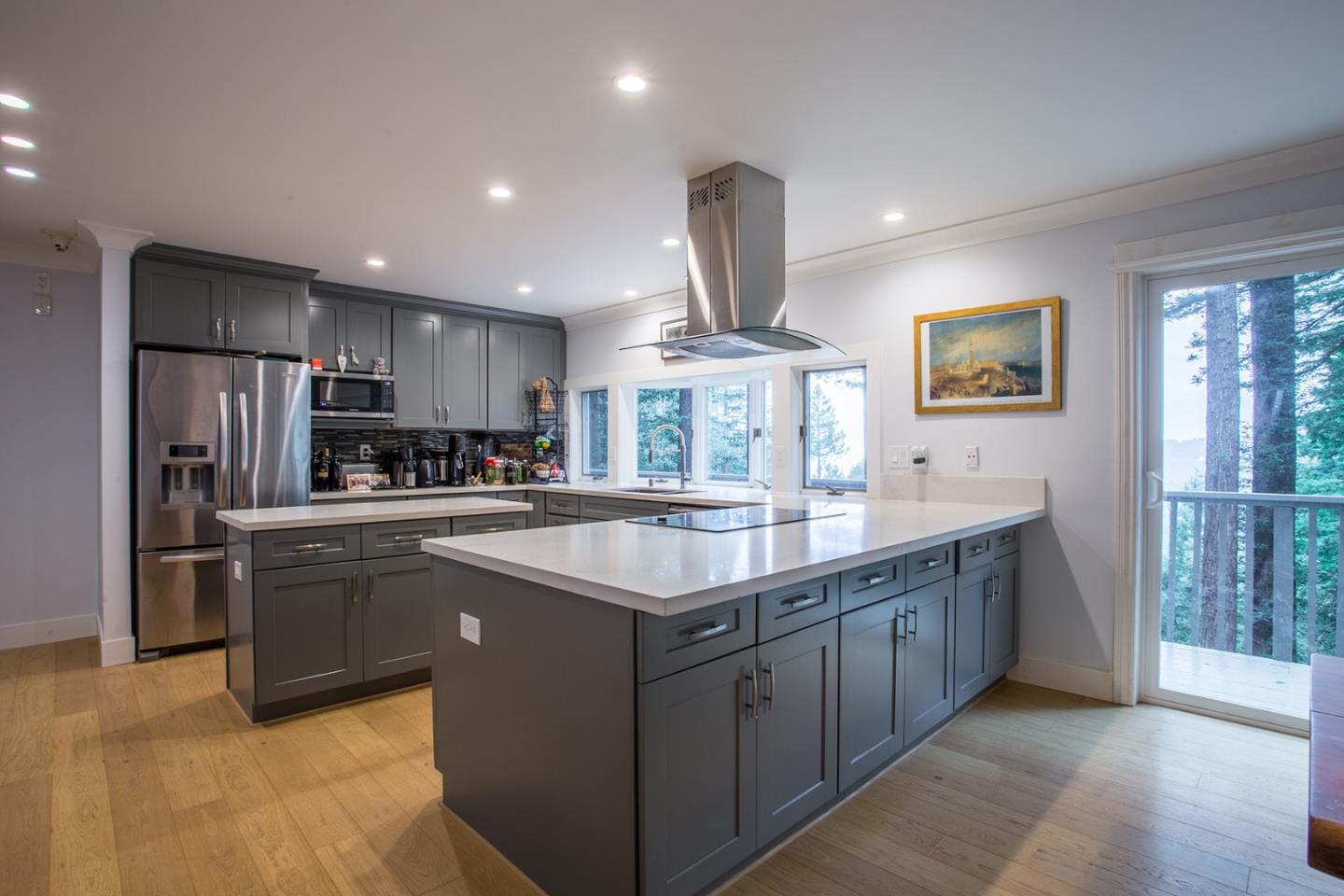 234 Swett Road Woodside, CA 94062 - Photo 5 of 20 a kitchen with stainless steel appliances granite countertop a sink counter space cabinets and a large window