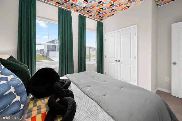 a bedroom with a bed and a lamp on table