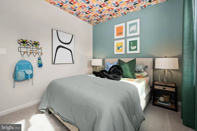 a bedroom with bed and window