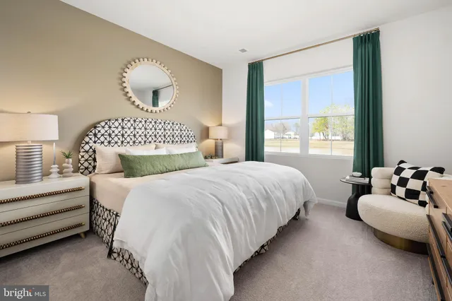 a dining room with wooden floor a chandelier a wooden table and chairs