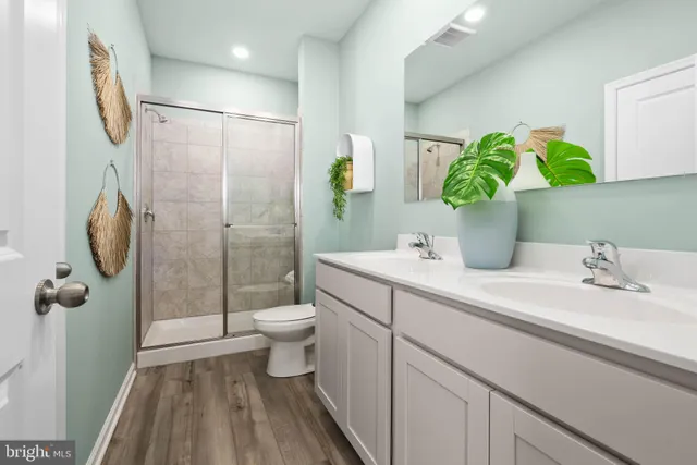 a view of a workspace with furniture and a bookshelf