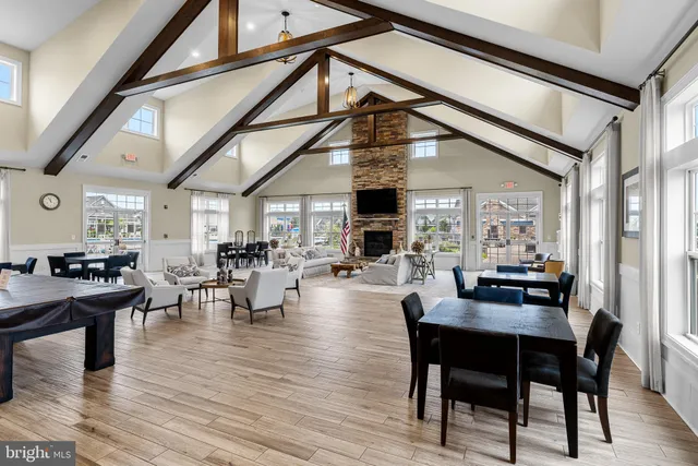 a view of a workspace with furniture and a book shelf