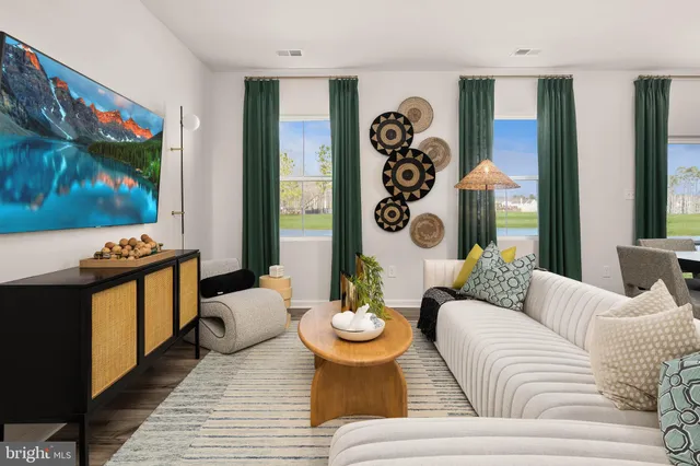 a living room with furniture and flat screen tv