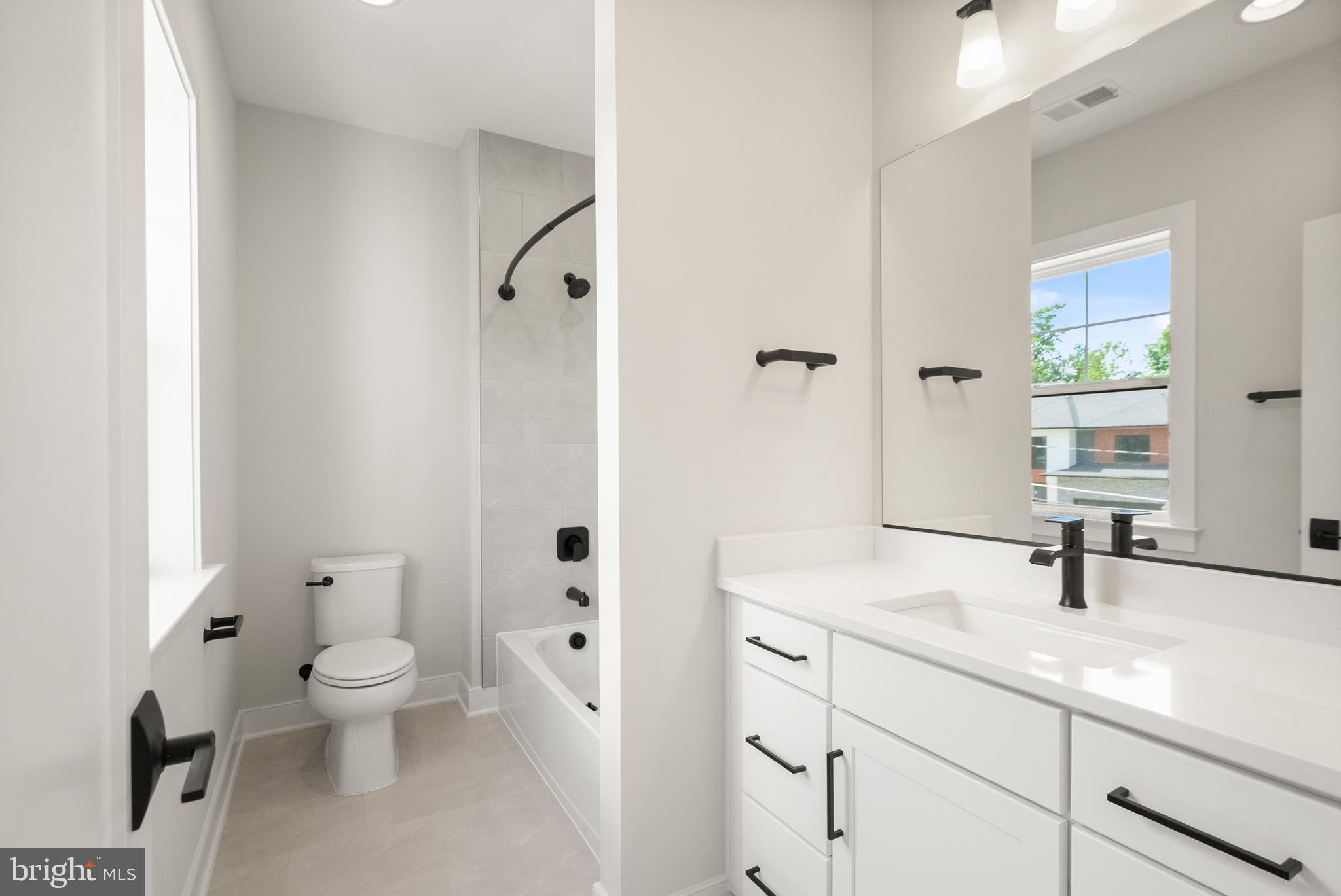7232 Andrus Road Bethesda, MD 20817 - Photo 24 of 36 Sleek modern bathroom with natural light.