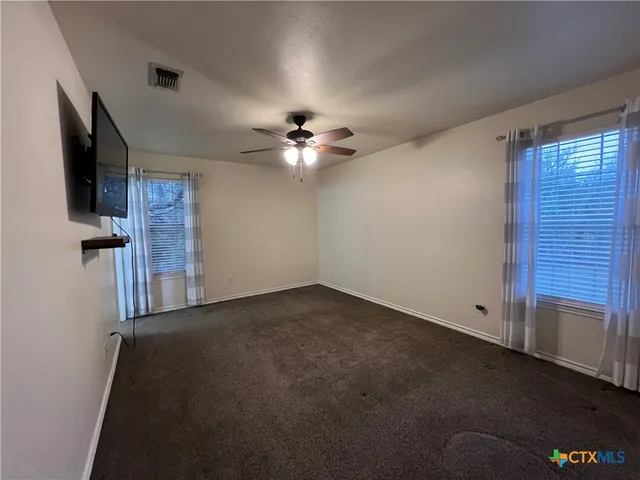 a bathroom with a toilet sink and shower