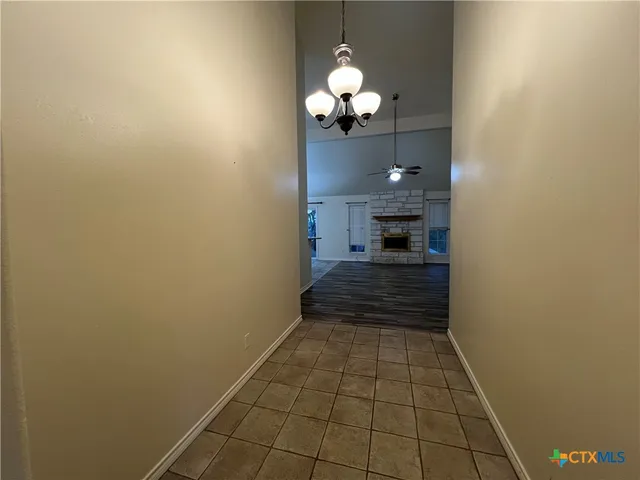a view of a hallway with a chandelier
