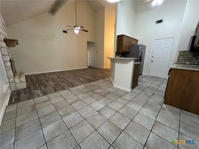 a kitchen with a sink and a refrigerator