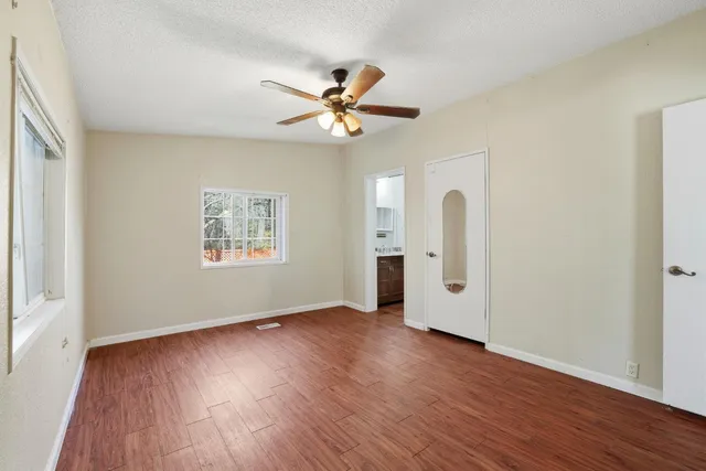 a bathroom with a sink mirror toilet and bathtub