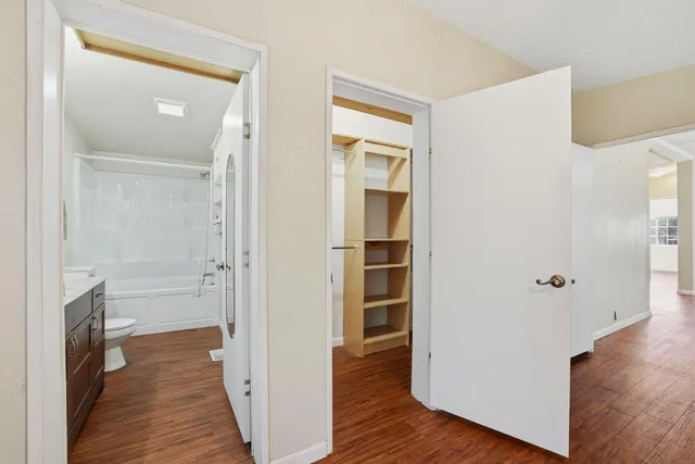 a view of a backyard with sitting area and tub