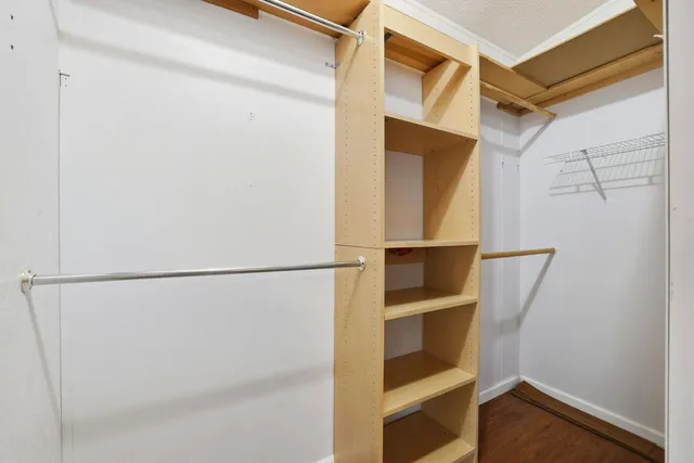 a view of backyard with wooden fence