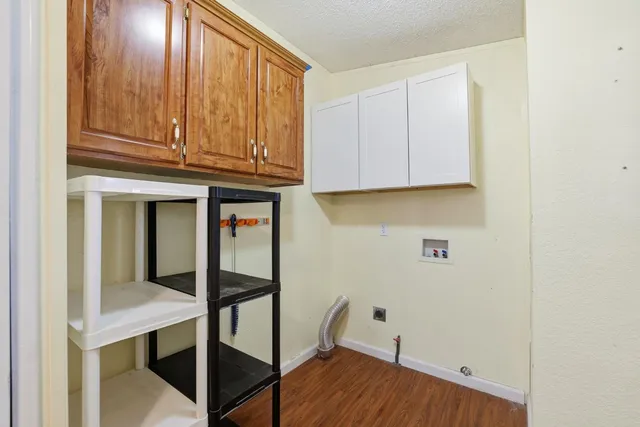 a view of balcony with wooden floor and fence