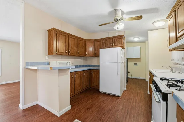 a view of kitchen with furniture and wooden floor