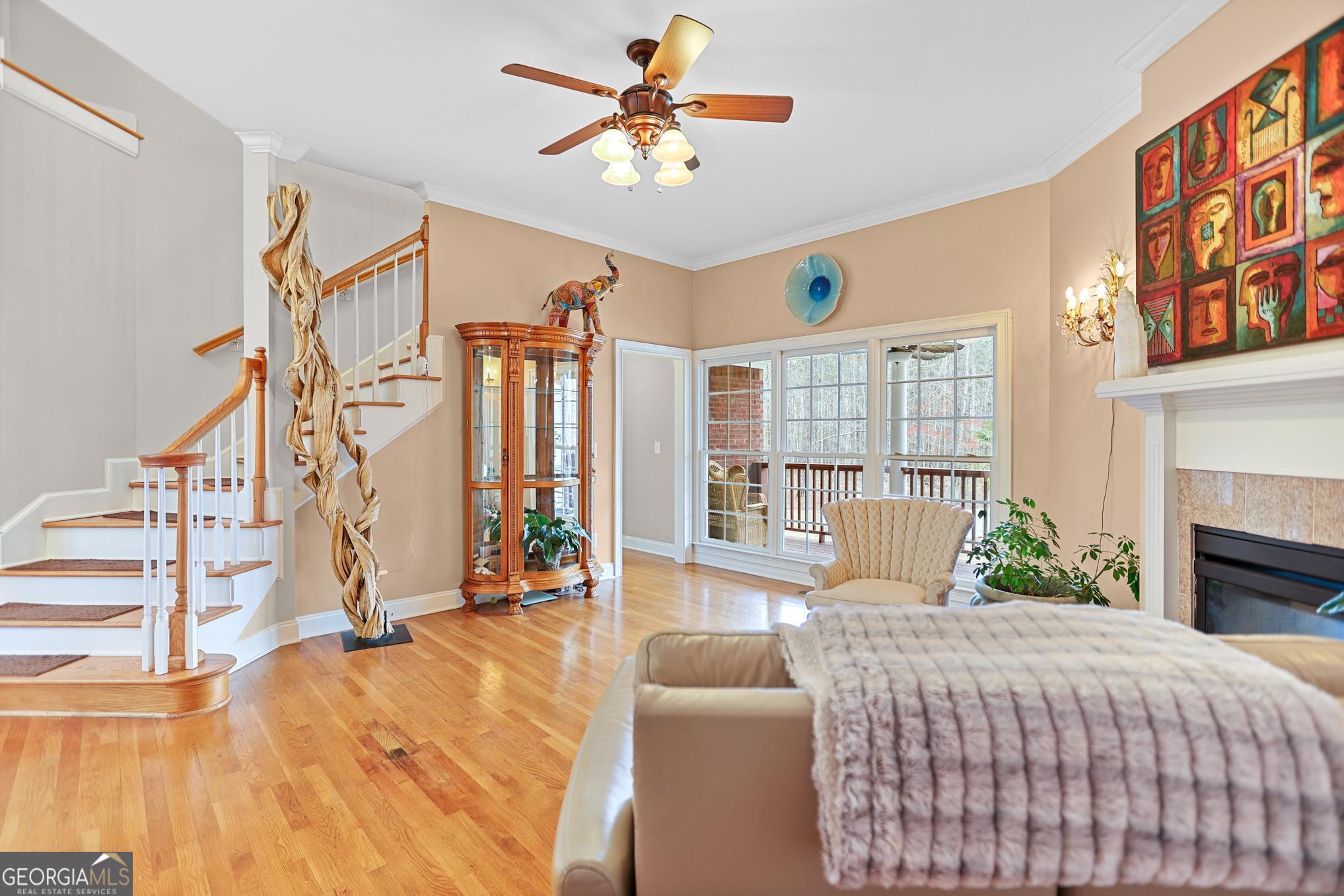 643 Old Greenville Road Fayetteville, GA 30215 - Photo 12 of 59 a bedroom with a bed couch and a large window with outer view