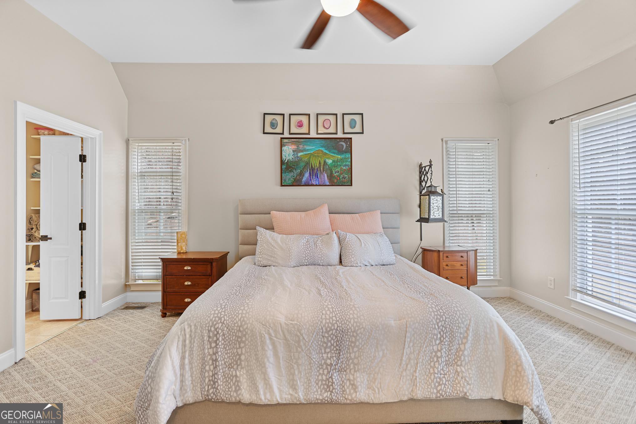 643 Old Greenville Road Fayetteville, GA 30215 - Photo 14 of 59 a bedroom with a bed and a window