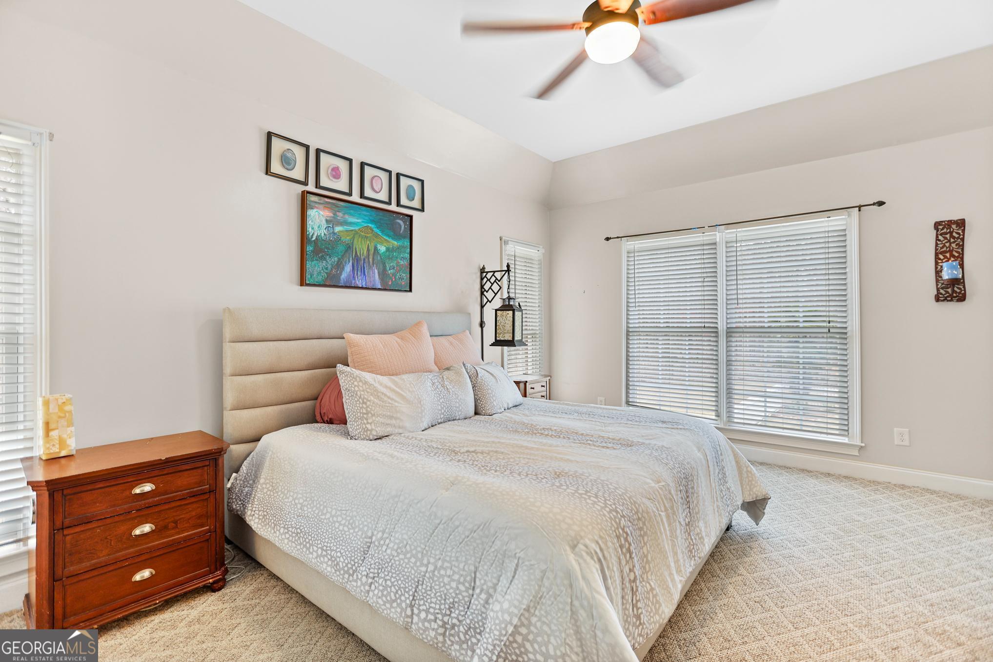 643 Old Greenville Road Fayetteville, GA 30215 - Photo 15 of 59 a bedroom with a bed and a window