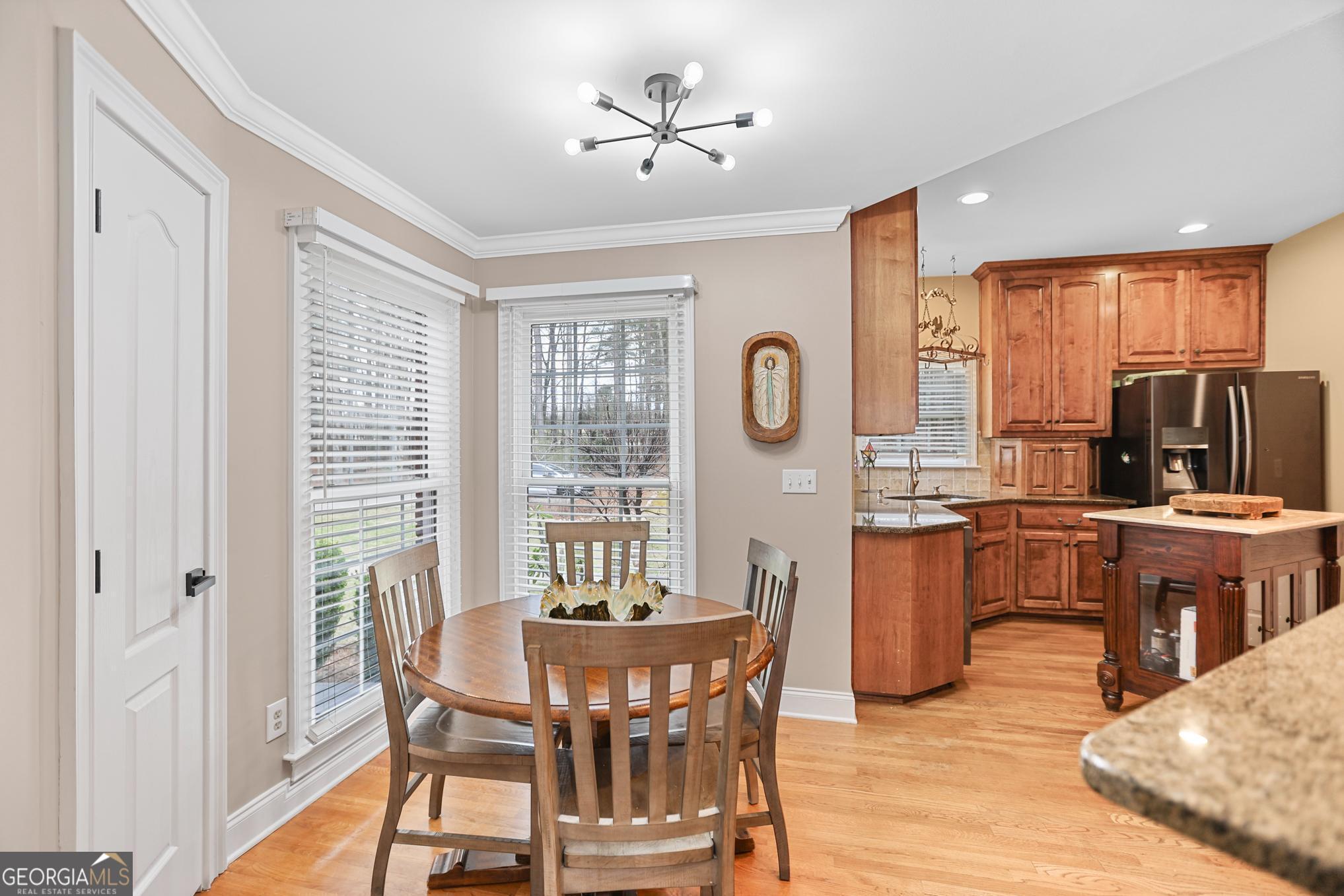 643 Old Greenville Road Fayetteville, GA 30215 - Photo 23 of 59 a view of a dining room with furniture window and wooden floor