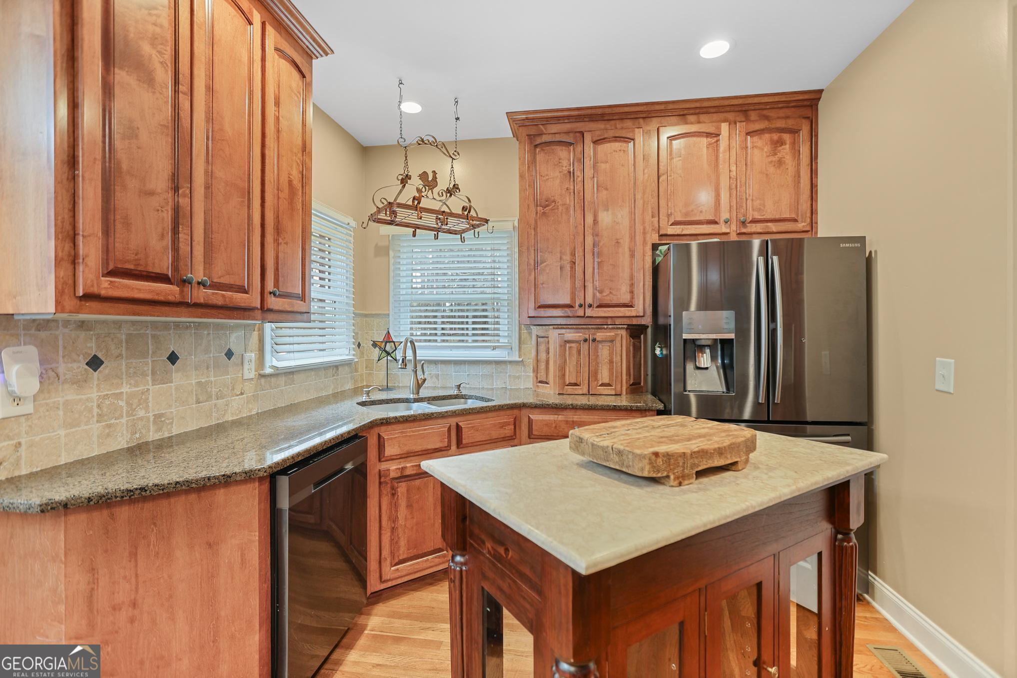 643 Old Greenville Road Fayetteville, GA 30215 - Photo 26 of 59 a kitchen with stainless steel appliances granite countertop a sink stove and refrigerator