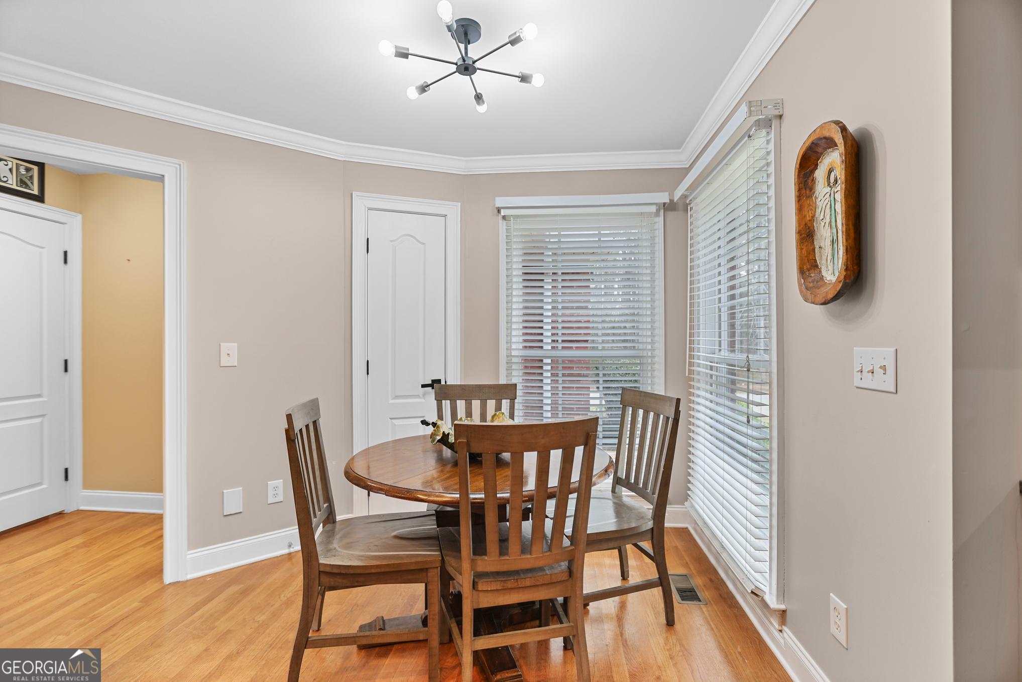 643 Old Greenville Road Fayetteville, GA 30215 - Photo 28 of 59 a view of a dining room with furniture and wooden floor
