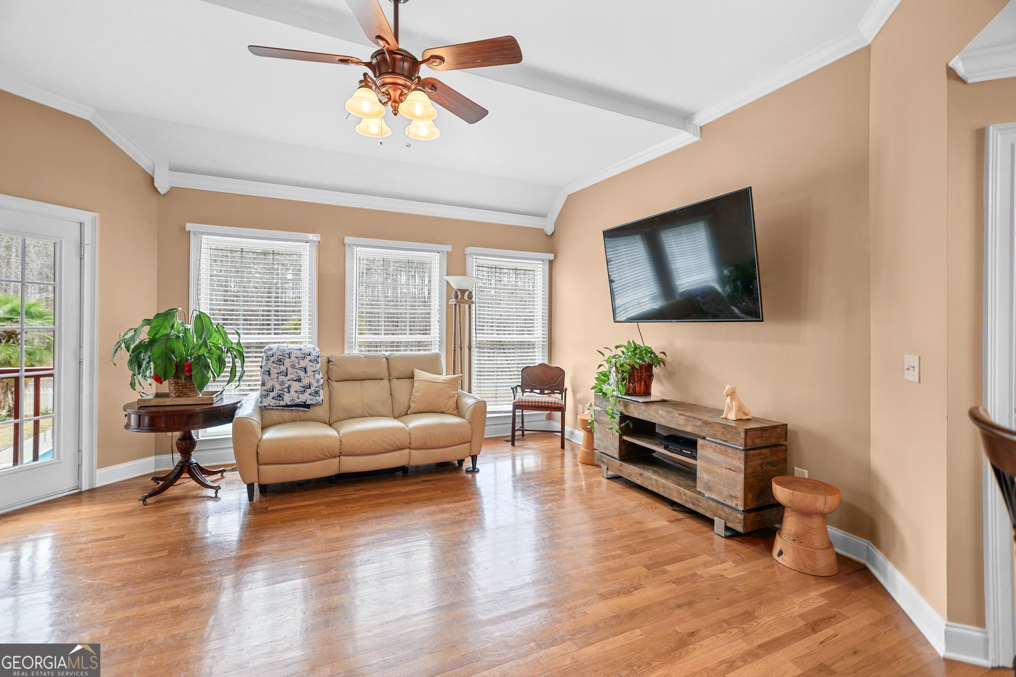 643 Old Greenville Road Fayetteville, GA 30215 - Photo 30 of 59 a living room with furniture and a flat screen tv