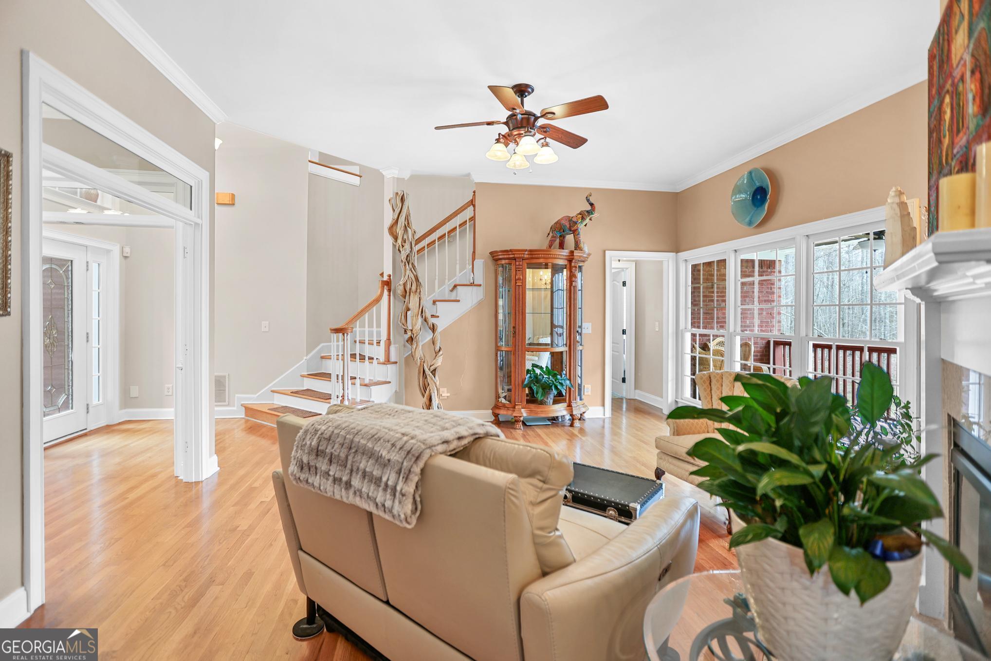 643 Old Greenville Road Fayetteville, GA 30215 - Photo 32 of 59 a living room with furniture and a potted plant