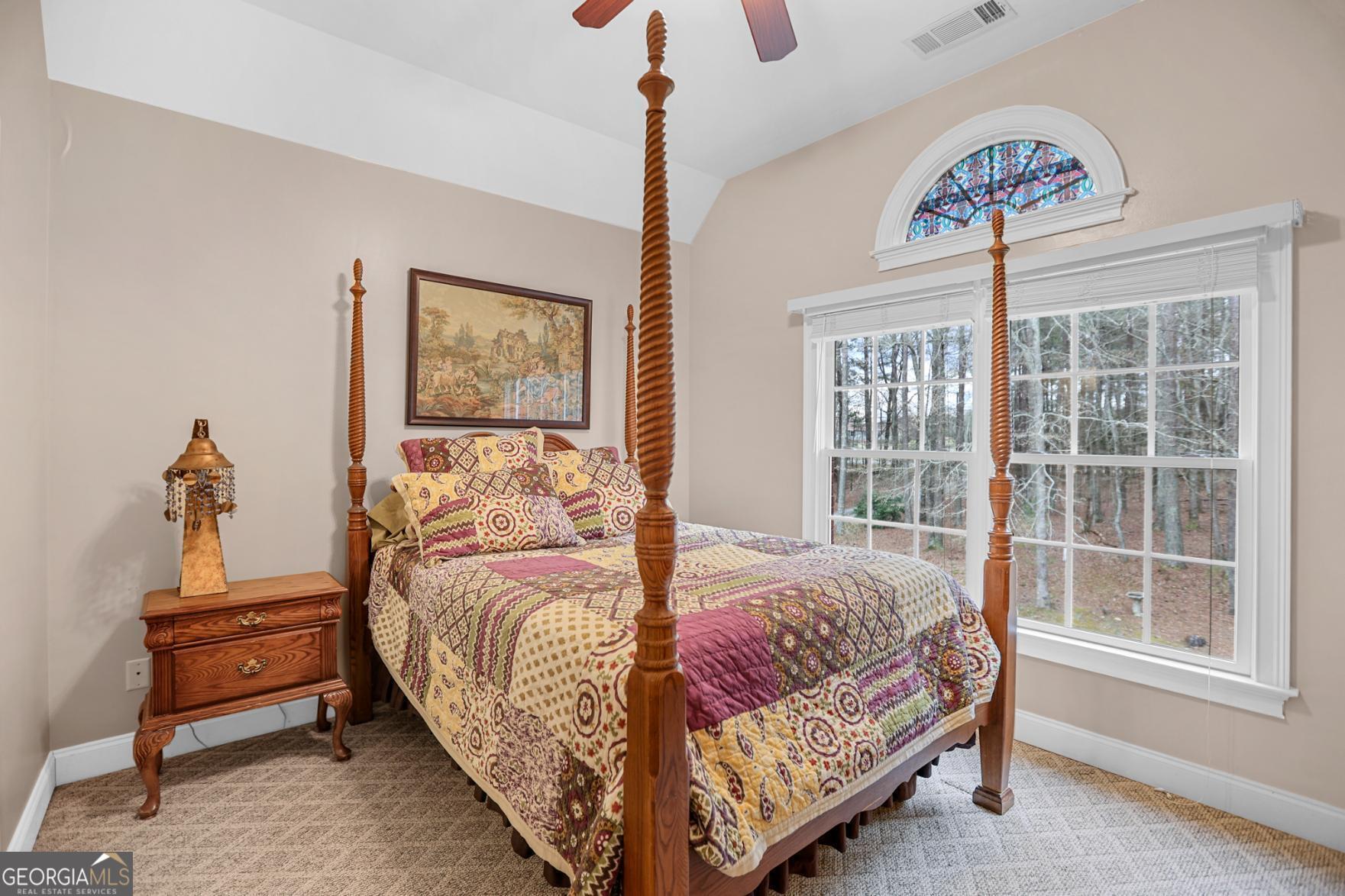 643 Old Greenville Road Fayetteville, GA 30215 - Photo 35 of 59 a bedroom with a bed and a window