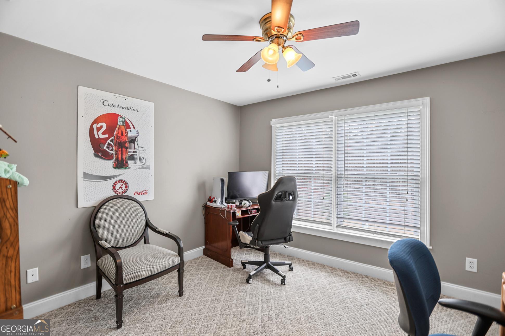 643 Old Greenville Road Fayetteville, GA 30215 - Photo 38 of 59 a view of a workspace with furniture and a window