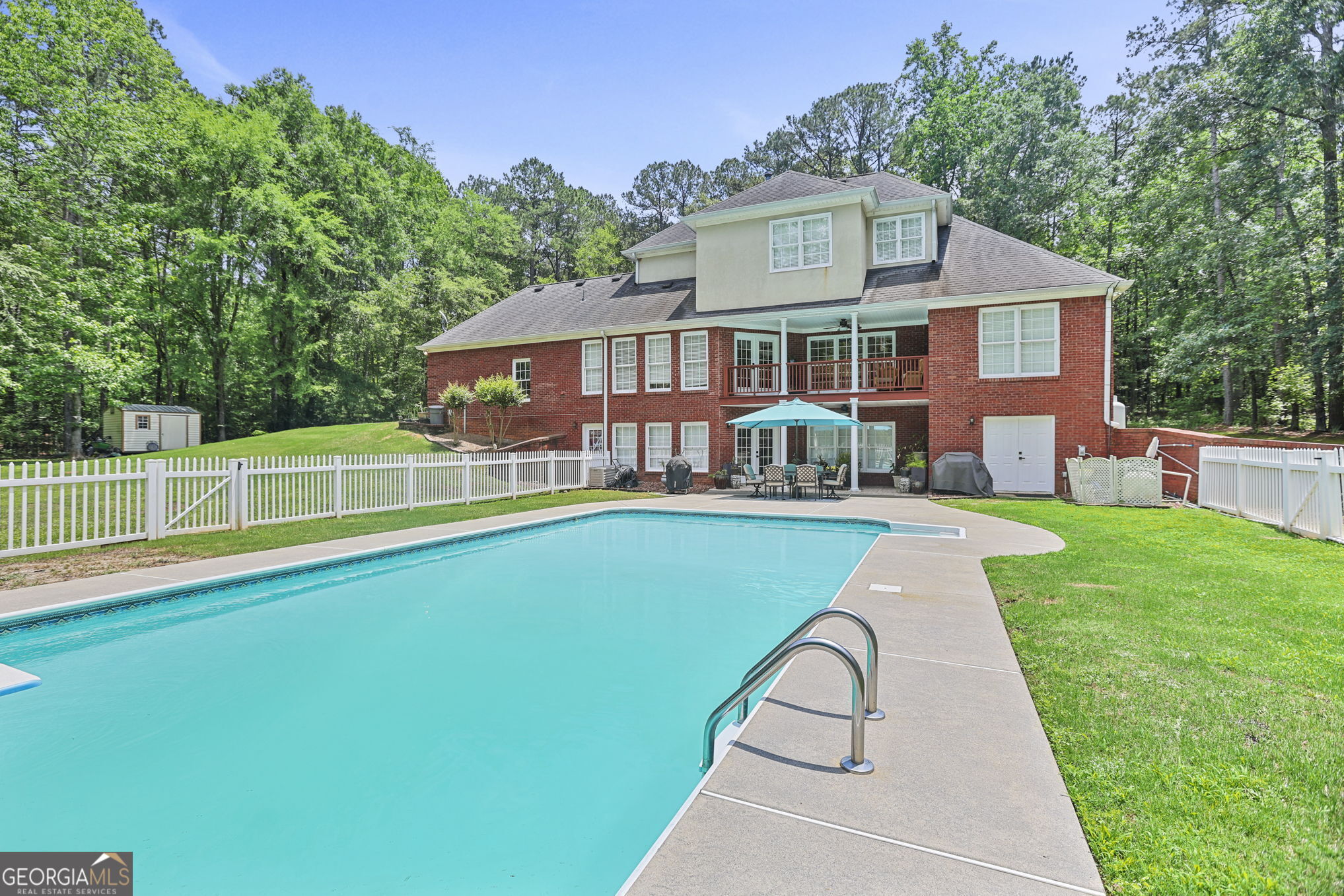 643 Old Greenville Road Fayetteville, GA 30215 - Photo 50 of 59 a front view of a house with a yard table and chairs