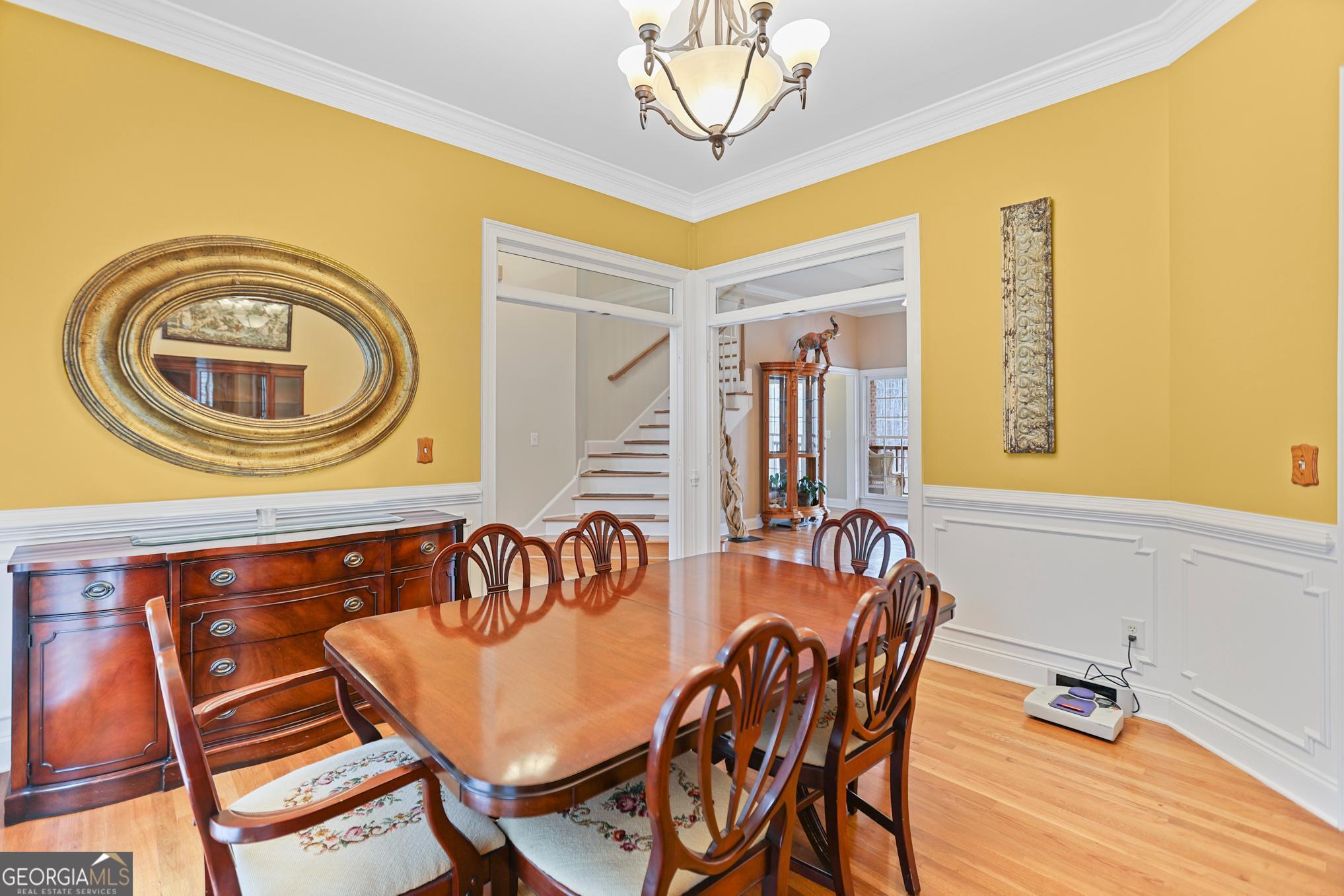 643 Old Greenville Road Fayetteville, GA 30215 - Photo 9 of 59 a dining room with furniture and a chandelier