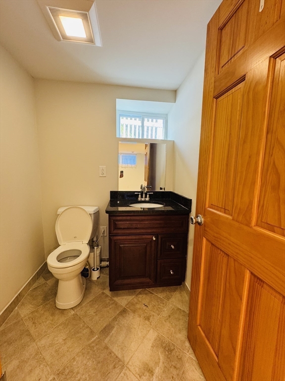 162 Palmer Street Quincy, MA 02169 - Photo 16 of 21 a bathroom with a sink and a toilet
